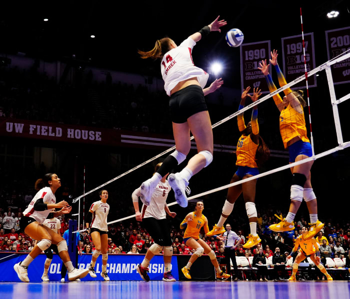 Wisconsin right side Anna Smrek (14) spikes the the ball during the fifth set of their regional final match against Pittsburgh at the Wisconsin Field House on Saturday December 10, 2022 in Madison, Wis.